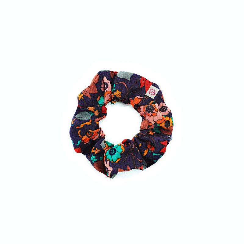 un chouchou pour cheveux aux teintes automnales Fleurs d'automne de la marque Bunzelle, en taille médium